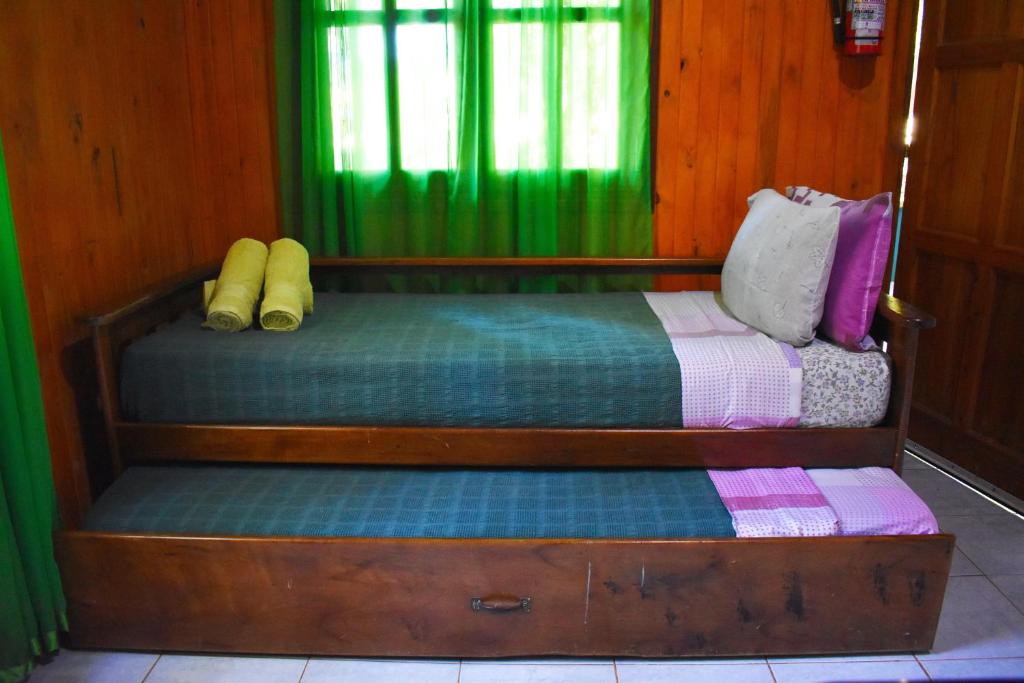 Letto o letti in una camera di Cabañas Oberá