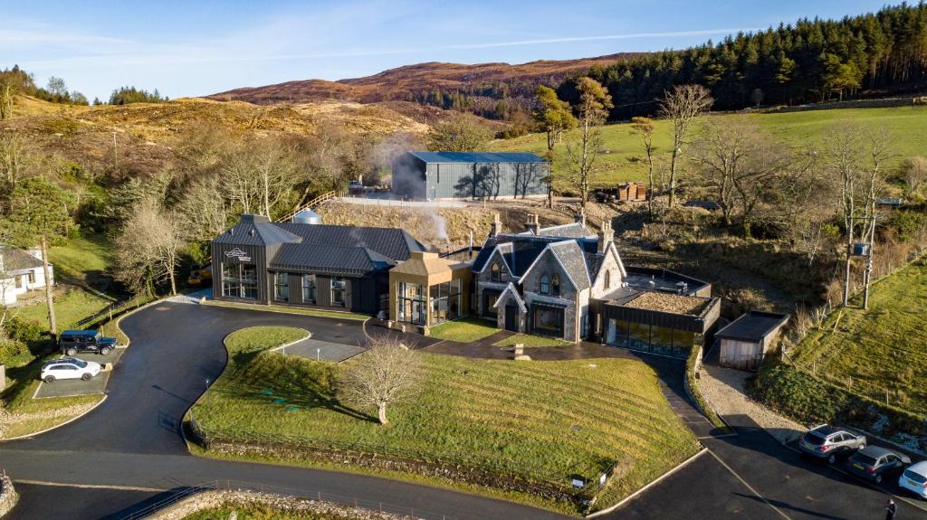 an aerial view of a house with a driveway at Isle of Raasay Distillery in Raasay