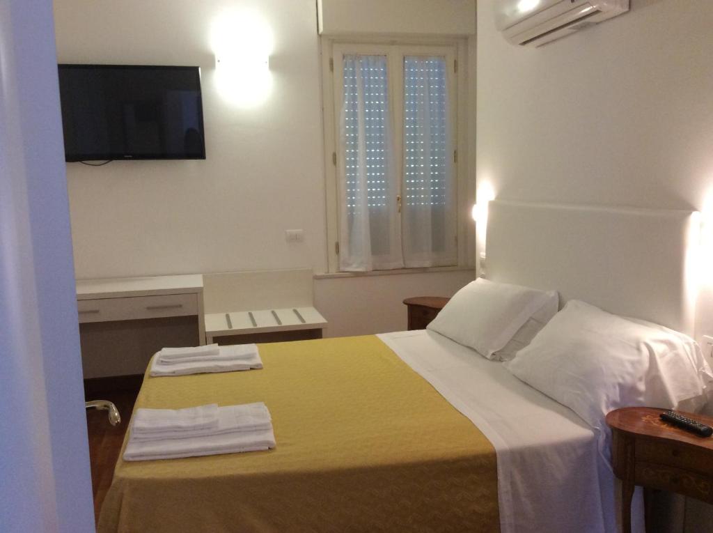 Säng eller sängar i ett rum på Residenza Grand Hotel Riccione