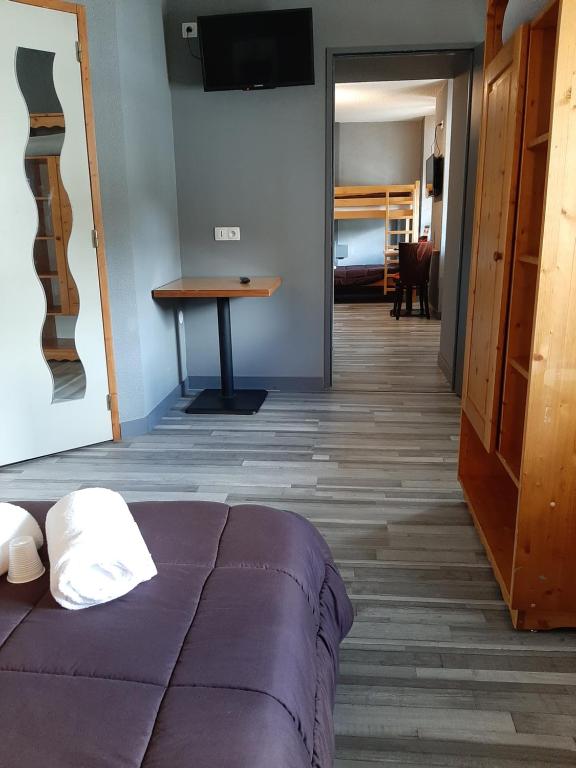 Postel nebo postele na pokoji v ubytování Hôtel de La Vallée