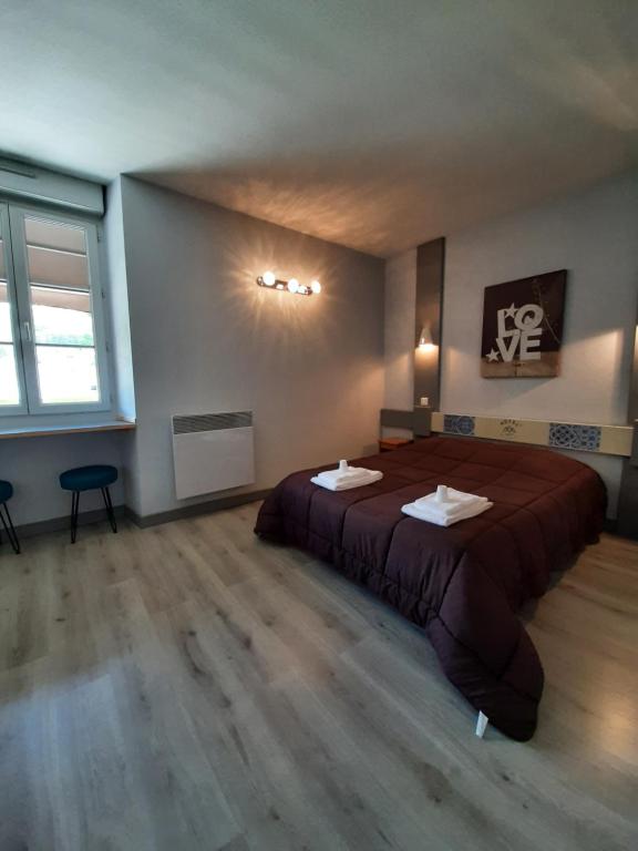 Postel nebo postele na pokoji v ubytování Hôtel de La Vallée