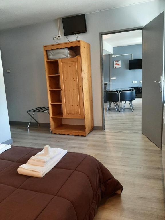 Postel nebo postele na pokoji v ubytování Hôtel de La Vallée