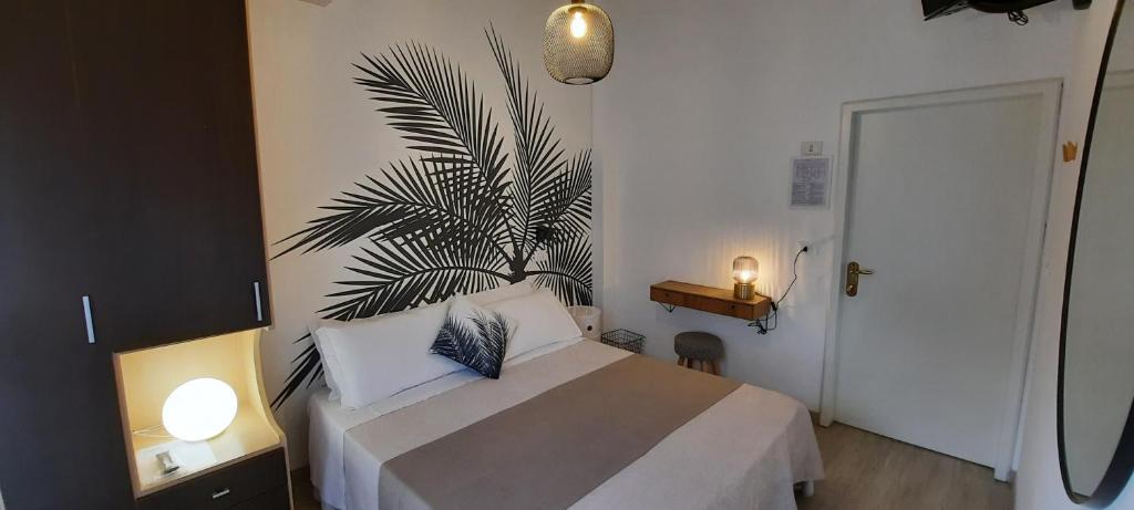 Postel nebo postele na pokoji v ubytování B&B Hotel Serenità