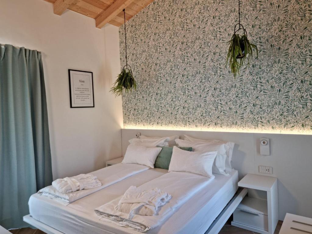 Postel nebo postele na pokoji v ubytování Elle Ecoholiday