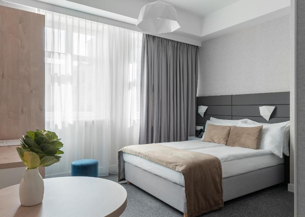 Postel nebo postele na pokoji v ubytování Hotel Gdynia Boutique