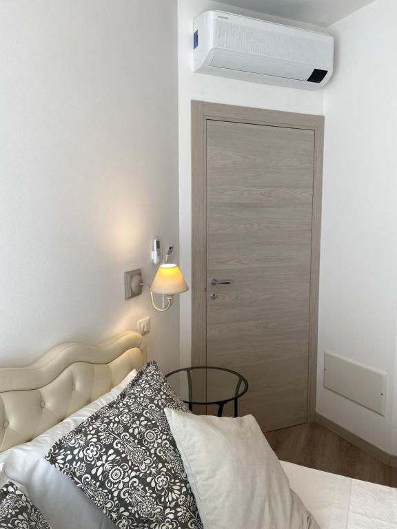 Postel nebo postele na pokoji v ubytování UNIQUE ROOMS