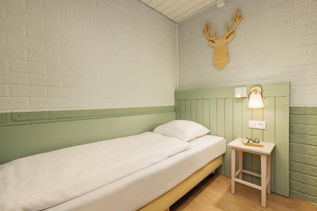 Postel nebo postele na pokoji v ubytování Center Parcs Erperheide