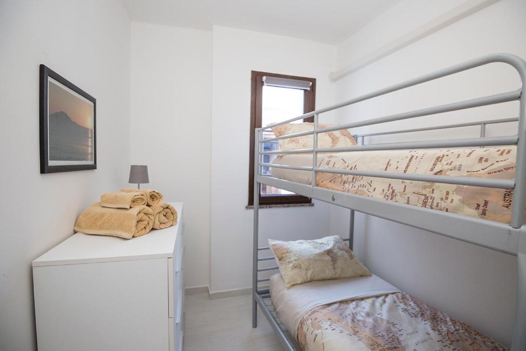 Postel nebo postele na pokoji v ubytování La Piazzetta