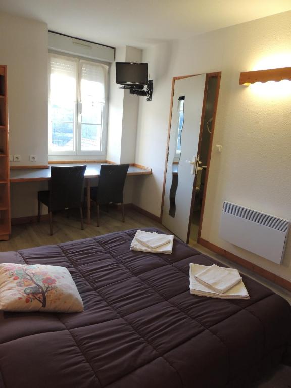 Postel nebo postele na pokoji v ubytování Hôtel de La Vallée