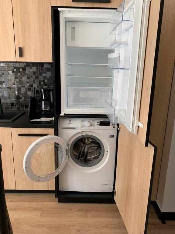 Kuchyňa alebo kuchynka v ubytovaní MiłoMi Apartamenty Kołobrzeg