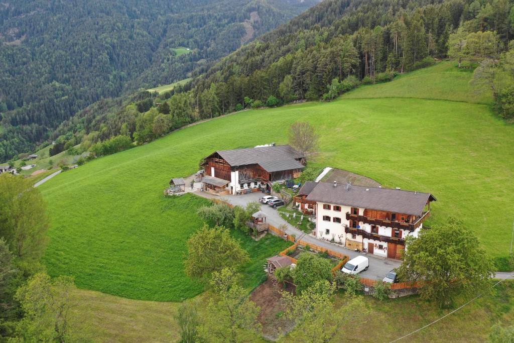 an aerial view of a large house in a field at Rasöller Hof in Villandro