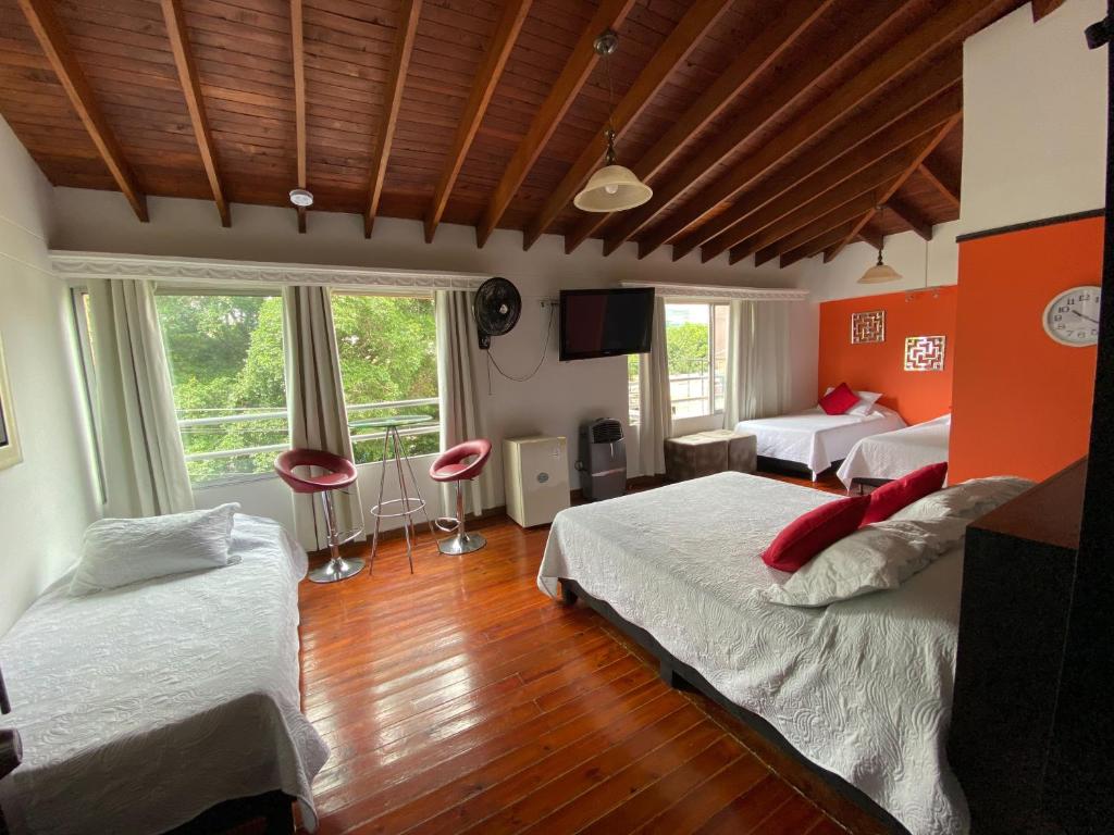 Postel nebo postele na pokoji v ubytování Hotel Lleras Premium #1