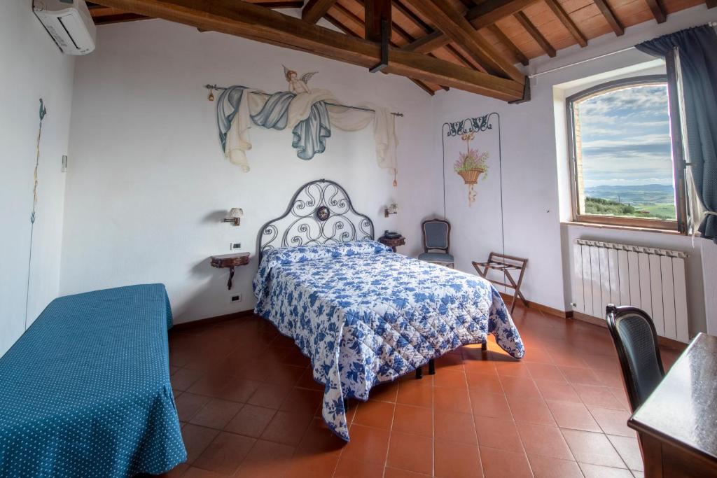 Postel nebo postele na pokoji v ubytování Hotel Vecchia Oliviera