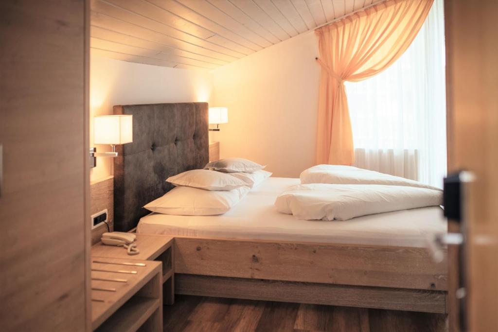 Postel nebo postele na pokoji v ubytování Hotel Rablanderhof