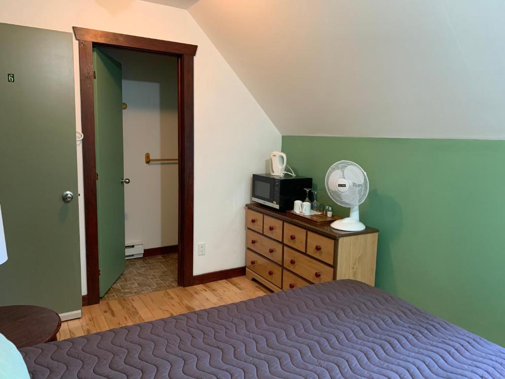 Postel nebo postele na pokoji v ubytování L'Auberge Refuge du Trappeur