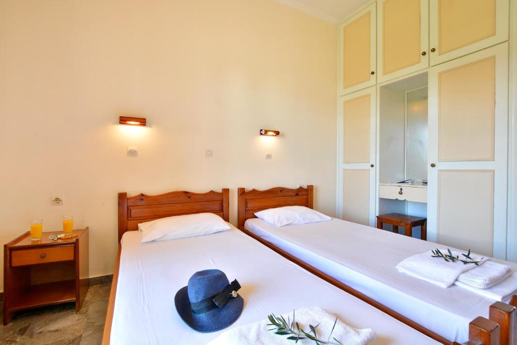 Postel nebo postele na pokoji v ubytování Adonis Apartments