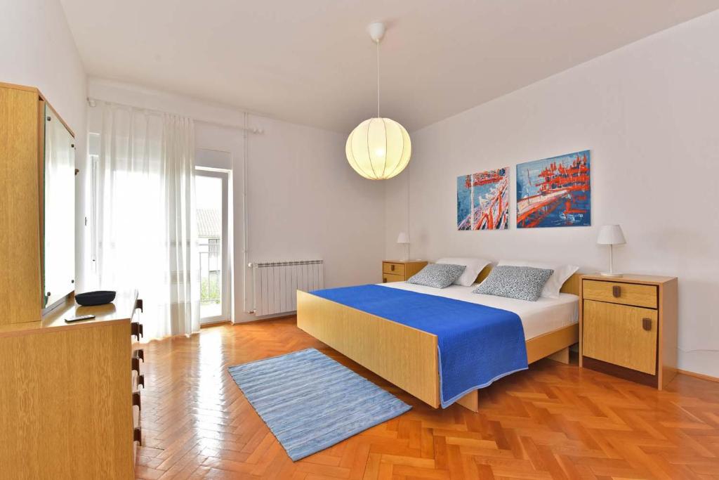 Posteľ alebo postele v izbe v ubytovaní Brezac olive garden apartment