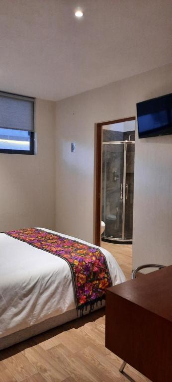 Postel nebo postele na pokoji v ubytování Hotel Del Valle