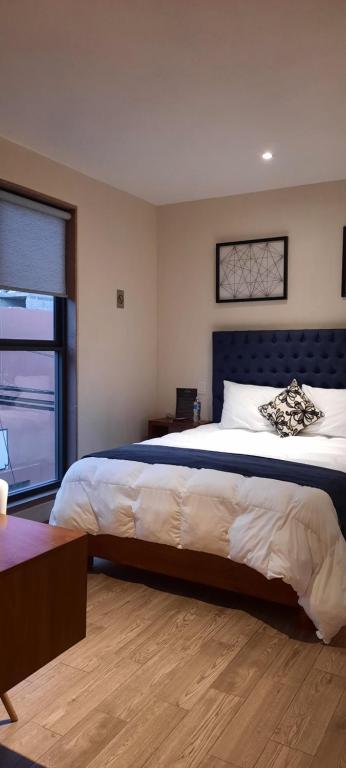 Postel nebo postele na pokoji v ubytování Hotel Del Valle