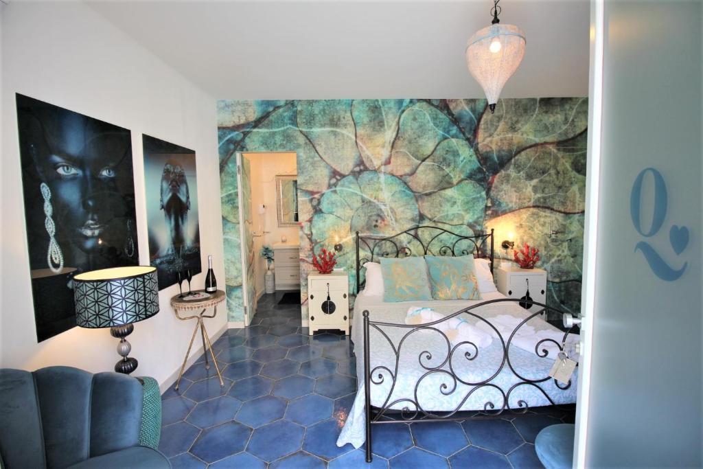 Postel nebo postele na pokoji v ubytování QuattroCuori Boutique Hotel & Spa