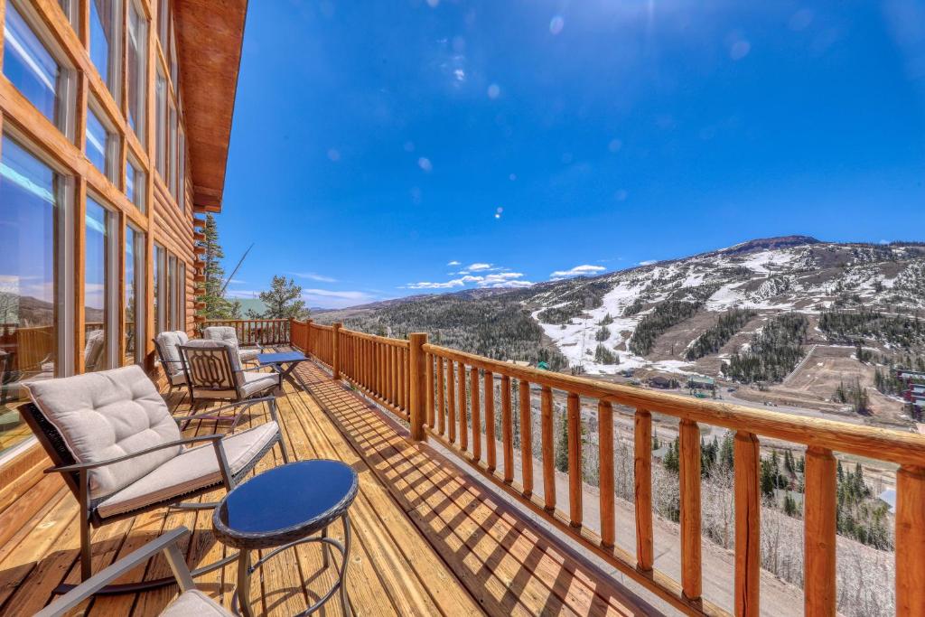 a balcony with chairs and a view of a mountain at Ski-View Lodge in Brian Head
