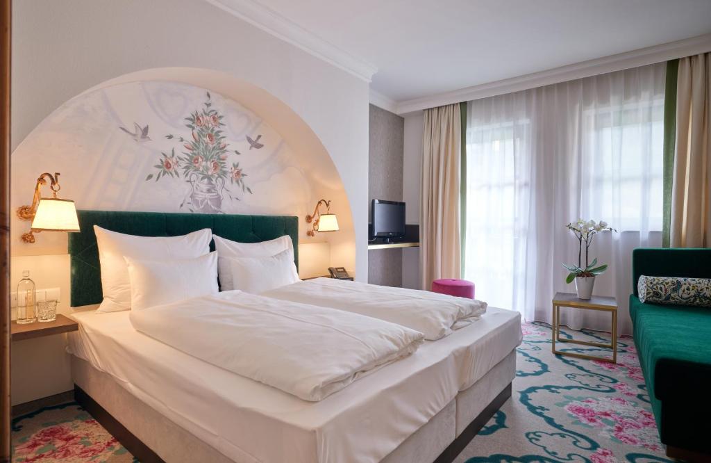 Postel nebo postele na pokoji v ubytování Hotel Pichlmayrgut