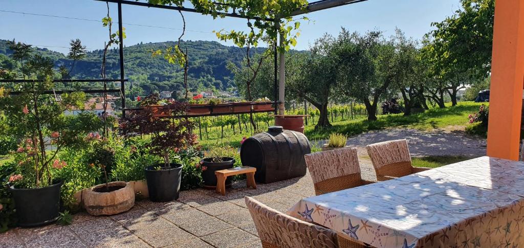 a patio with a table and chairs with a view at APARTMA NANA STRUNJAN in Portorož