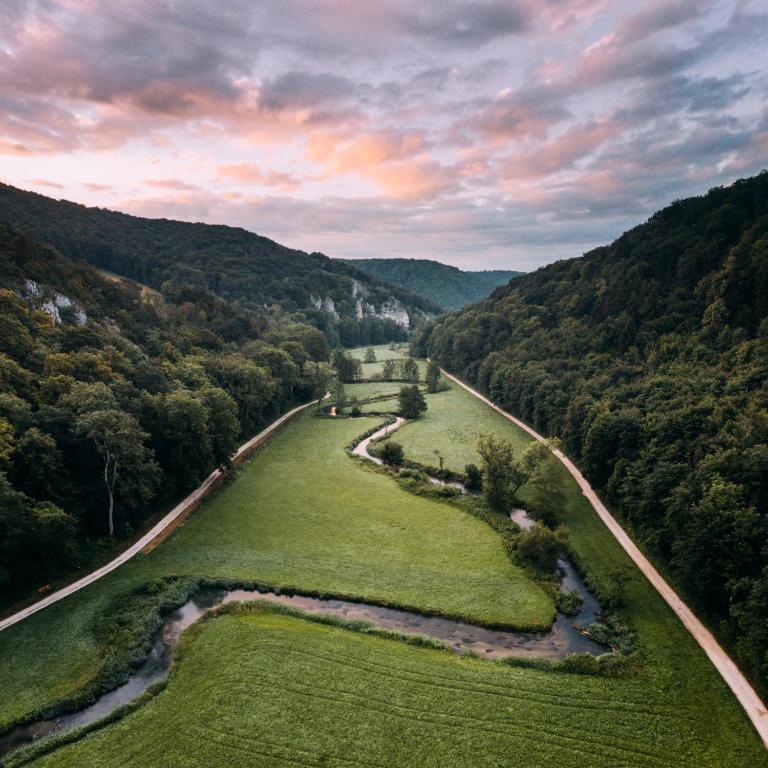 an aerial view of a river in a valley at Ferienwohnung Lautertal Haus Barbara in Indelhausen