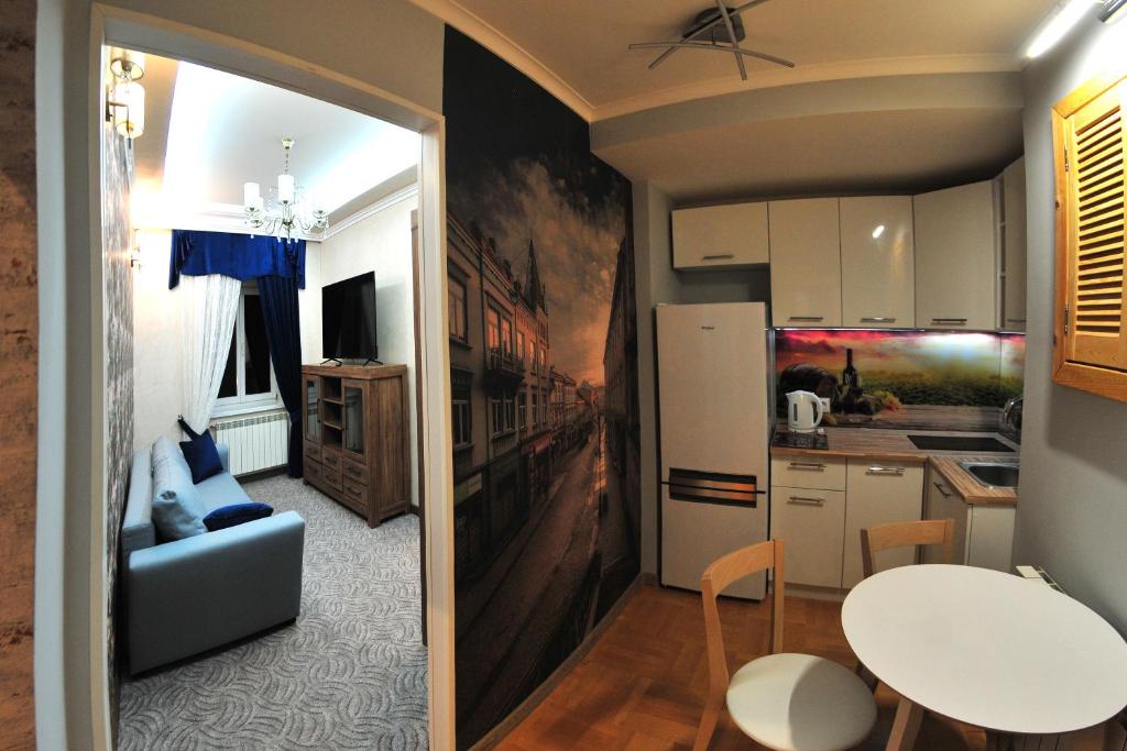 Kuchyň nebo kuchyňský kout v ubytování APARTAMENTY NA MNISZEJ