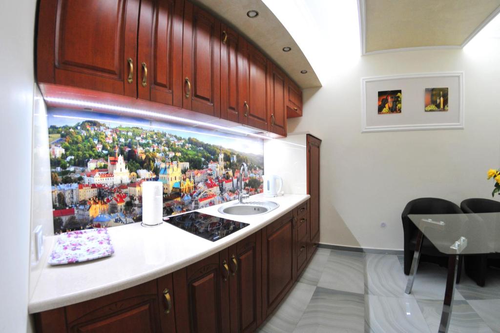 Kuchyň nebo kuchyňský kout v ubytování APARTAMENTY NA MNISZEJ
