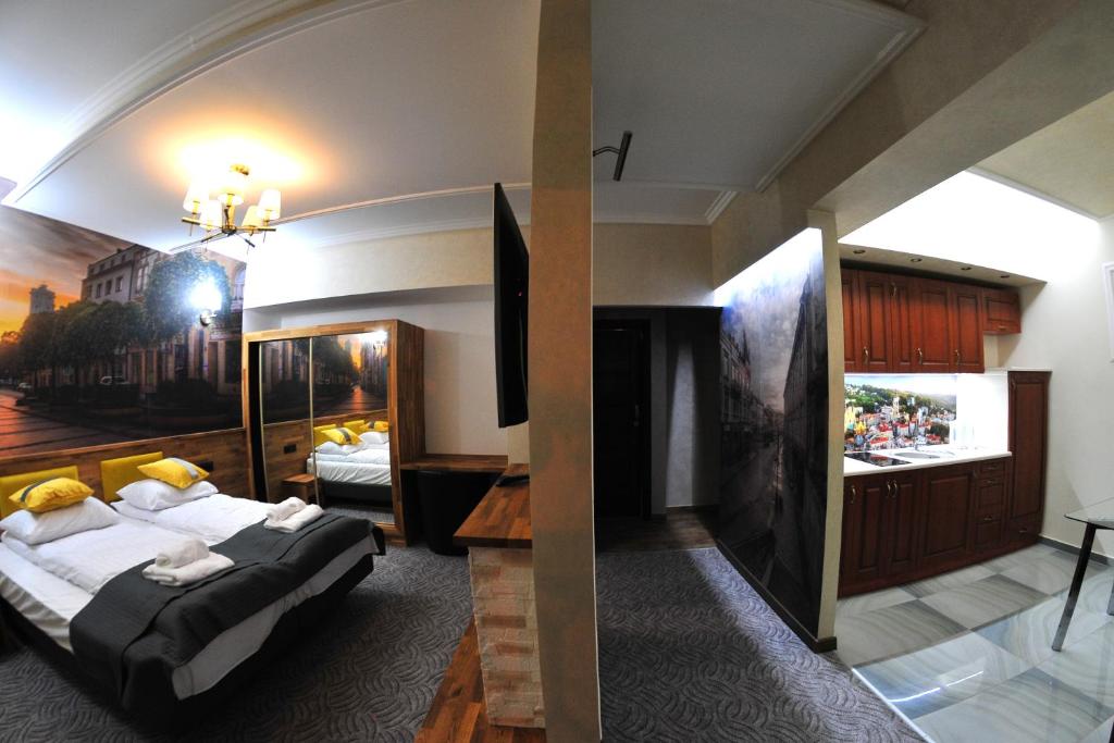 Postel nebo postele na pokoji v ubytování APARTAMENTY NA MNISZEJ