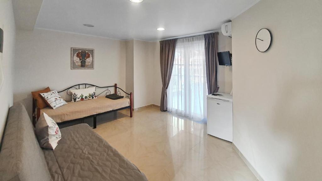 Postel nebo postele na pokoji v ubytování Seaflows Apartments #1