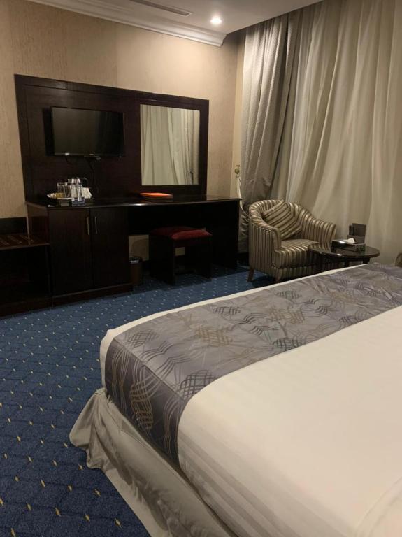 Postel nebo postele na pokoji v ubytování Al Maali Hotel Jazan