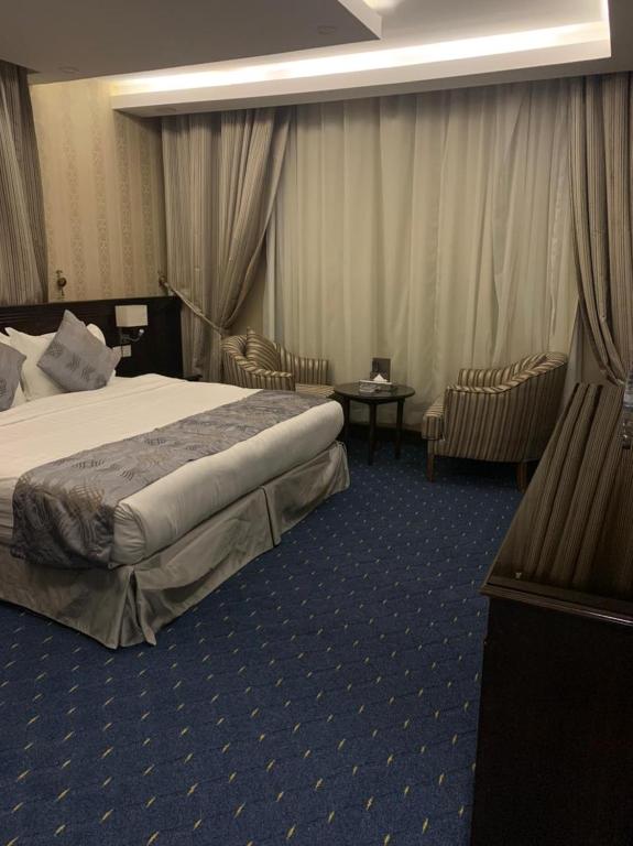 Postel nebo postele na pokoji v ubytování Al Maali Hotel Jazan