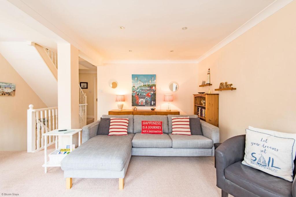a living room with a couch and a chair at The Landing in Hythe