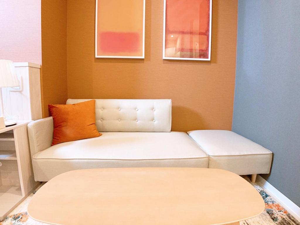 Postel nebo postele na pokoji v ubytování Bar & Hotel Colors MIYAJIMA