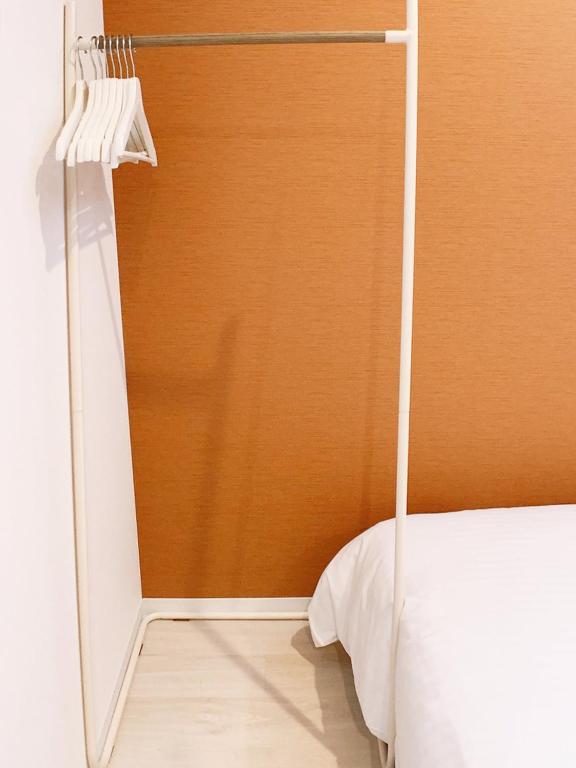 Postel nebo postele na pokoji v ubytování Bar & Hotel Colors MIYAJIMA