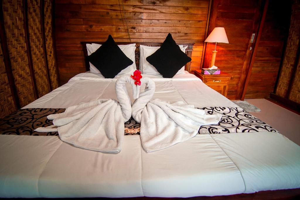 Postel nebo postele na pokoji v ubytování Pondok Bali Cottage