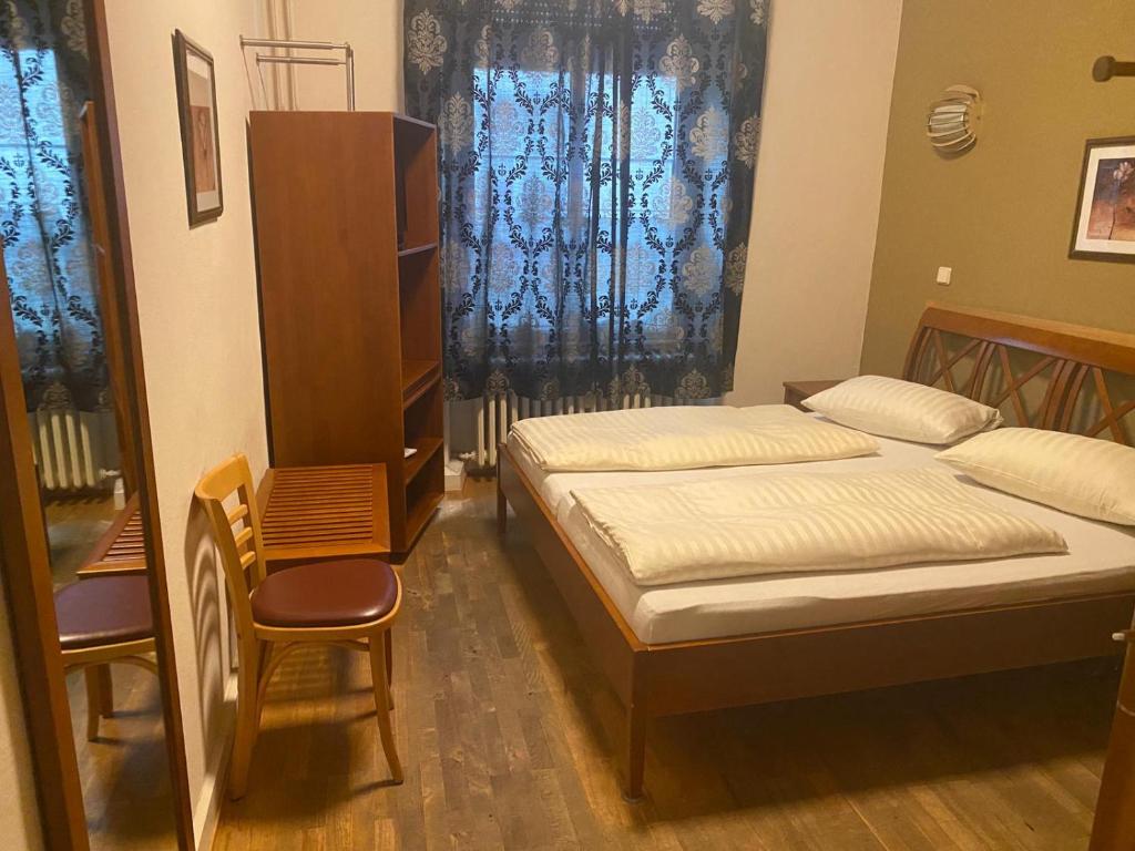 Postel nebo postele na pokoji v ubytování Hotel Restaurant Frankenturm