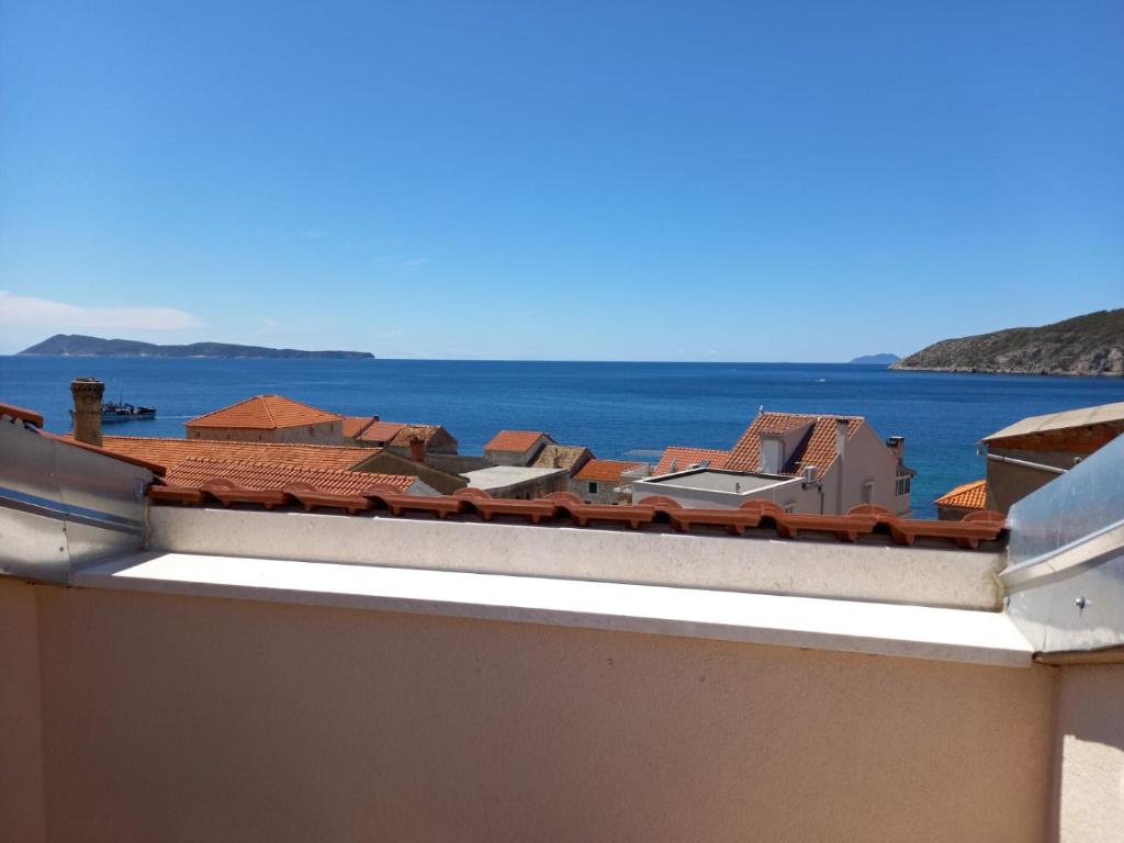a view of the ocean from the roof of a building at Seaview Suites Ondina in Komiža
