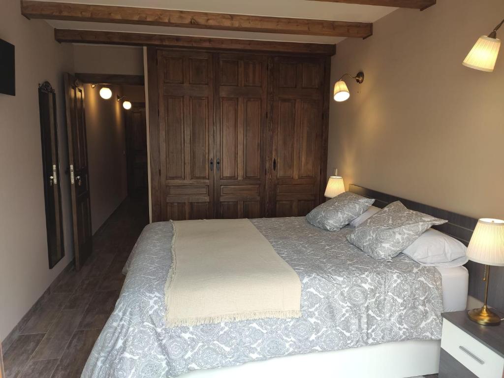 A bed or beds in a room at LAS 4 ESTACIONES - Rascafría