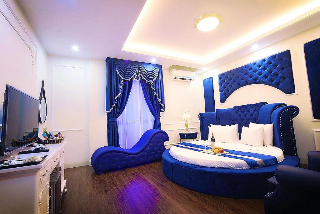 Postel nebo postele na pokoji v ubytování Hotel Royal II