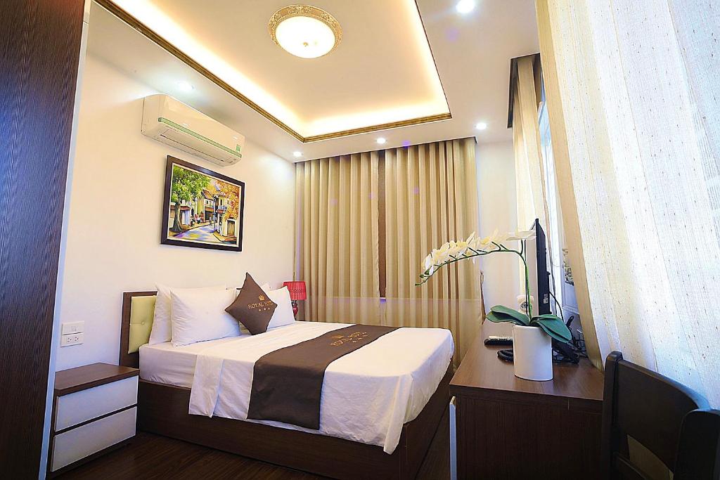 Postel nebo postele na pokoji v ubytování Hotel Royal II