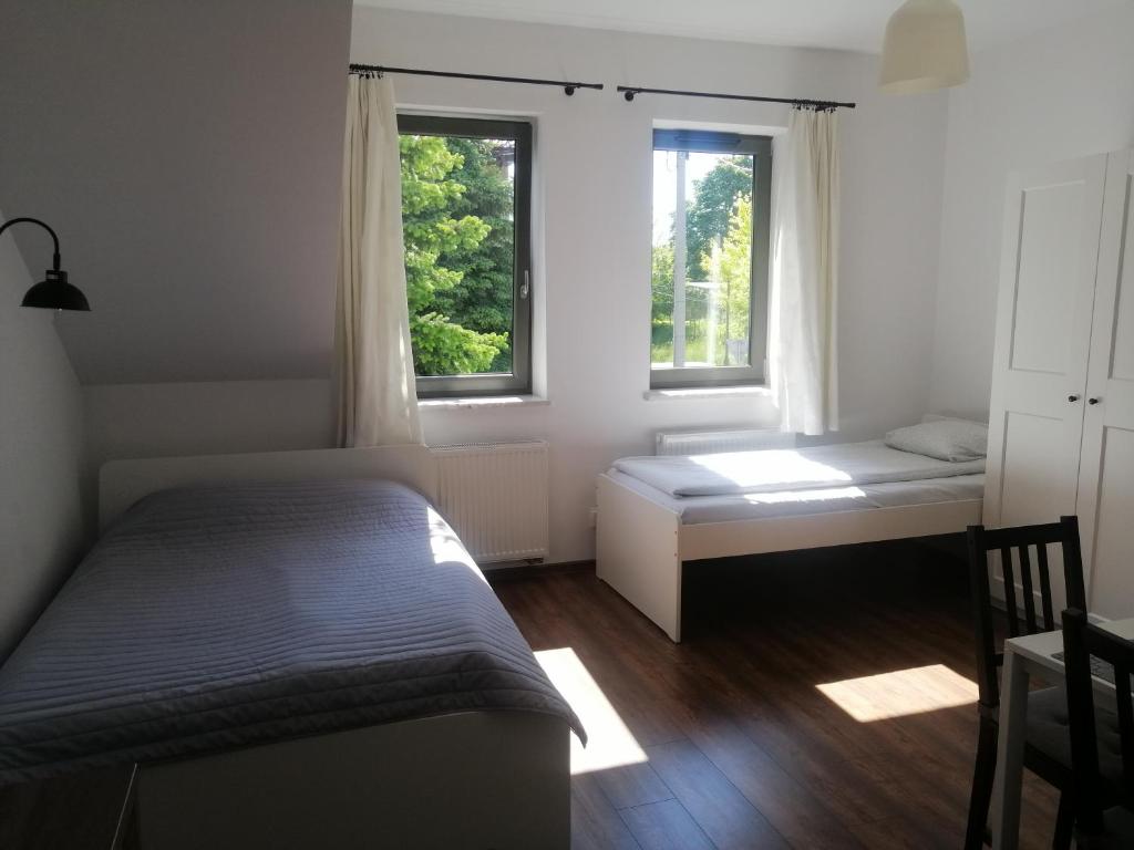Posteľ alebo postele v izbe v ubytovaní Prokocim Apartments