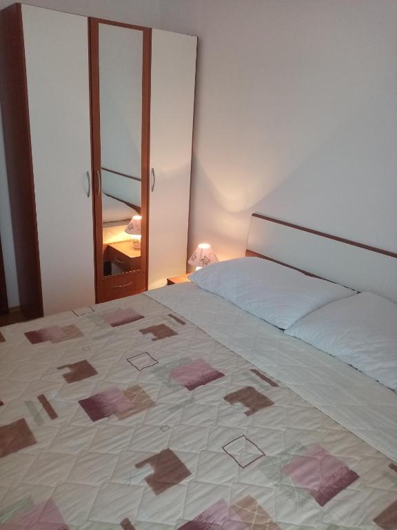 Postel nebo postele na pokoji v ubytování Pave Apartment