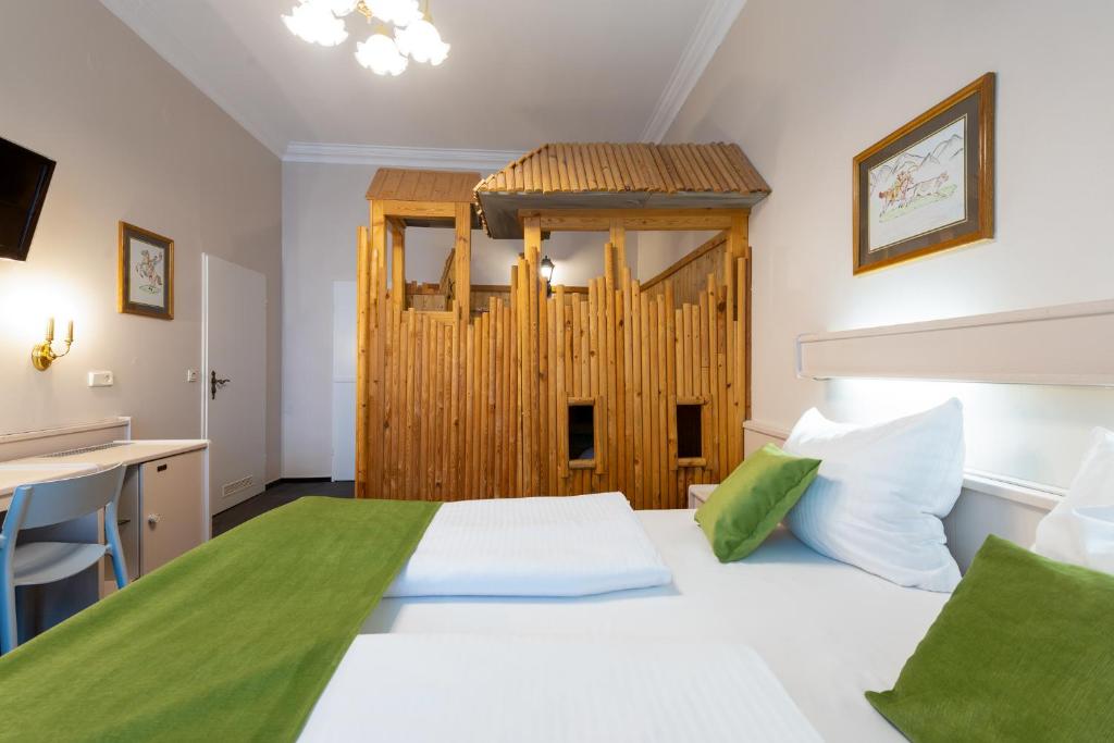 Postel nebo postele na pokoji v ubytování W22 Hotel am Kurfürstendamm