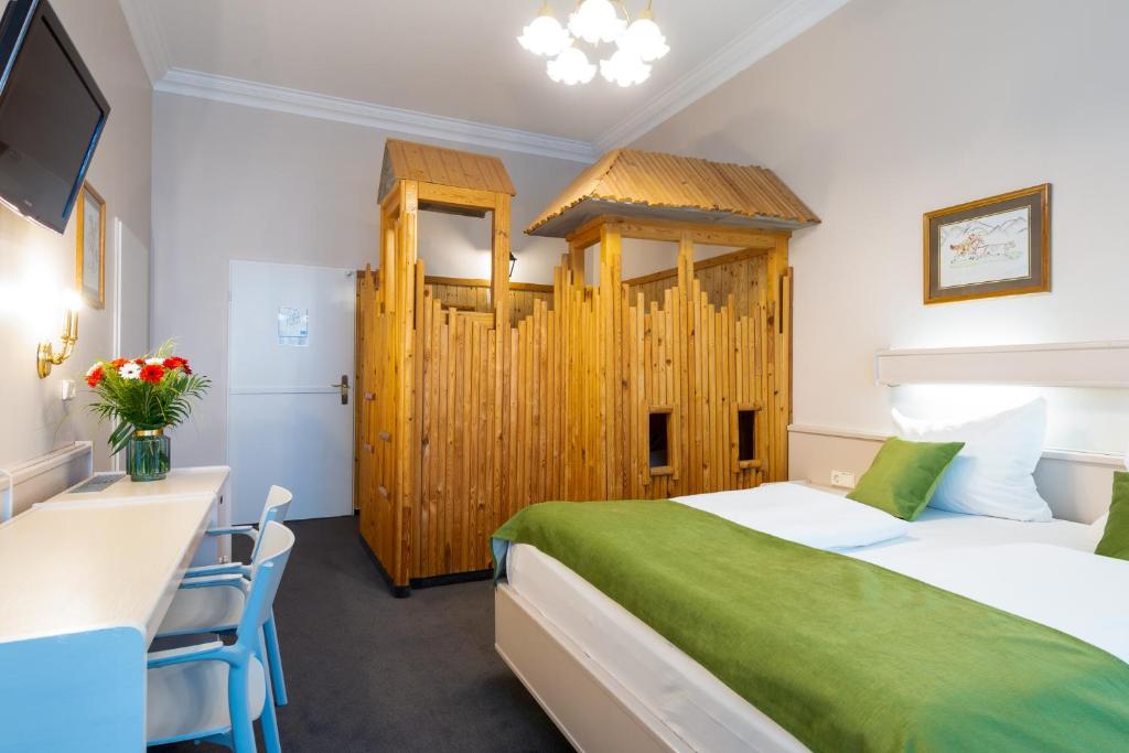 Postel nebo postele na pokoji v ubytování W22 Hotel am Kurfürstendamm