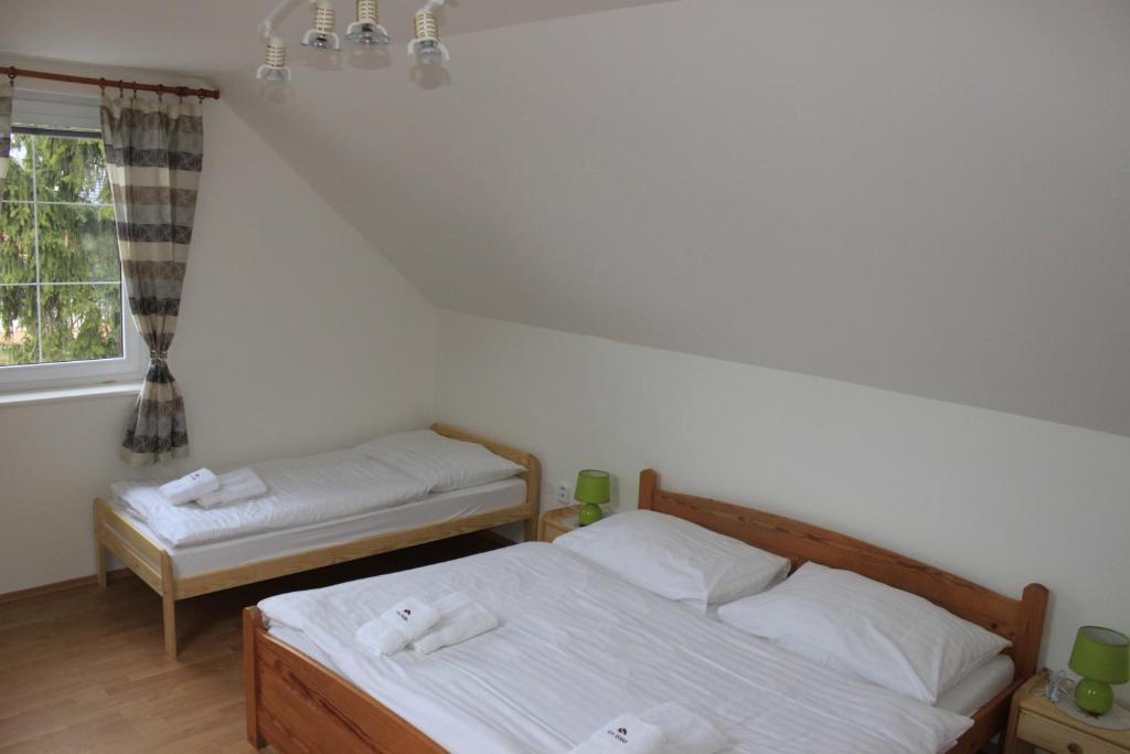 Postel nebo postele na pokoji v ubytování Dom Via Jasná Demänová