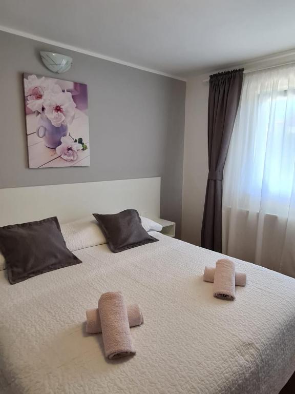 Postel nebo postele na pokoji v ubytování Apartments Jurić