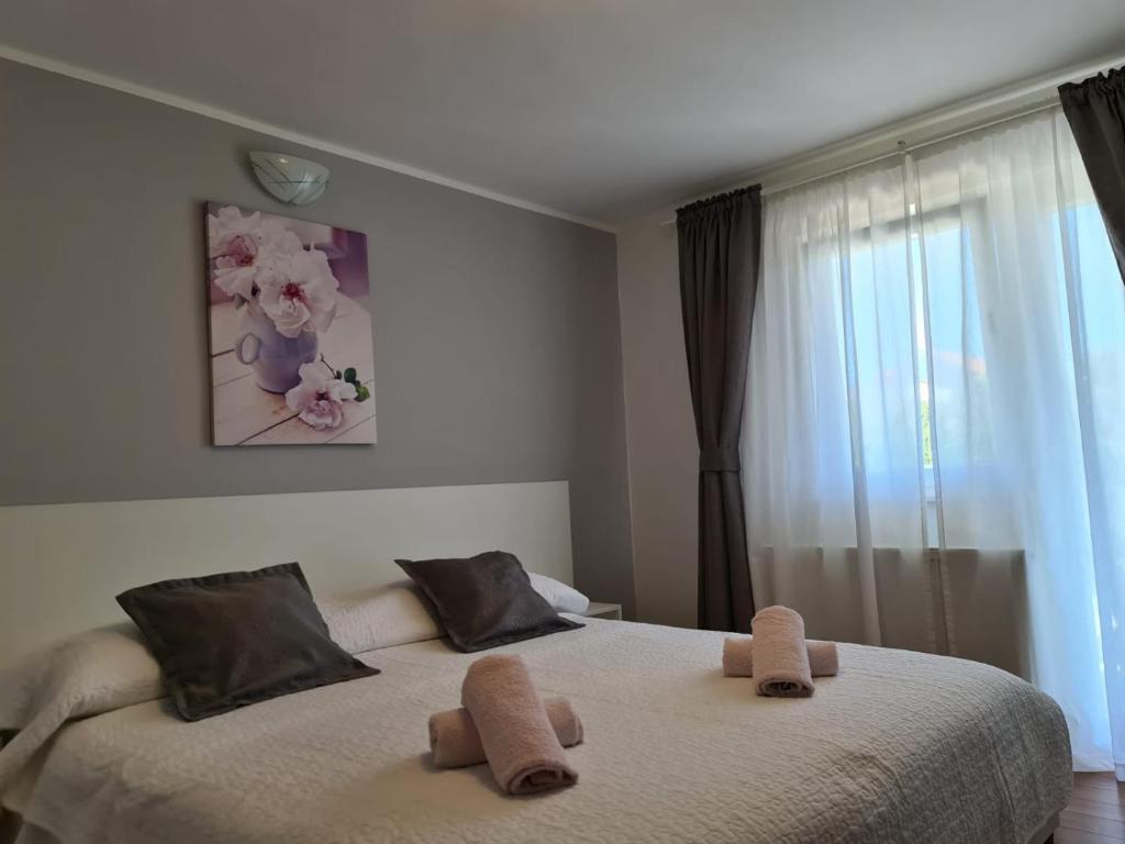 Postel nebo postele na pokoji v ubytování Apartments Jurić